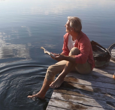 man by lake